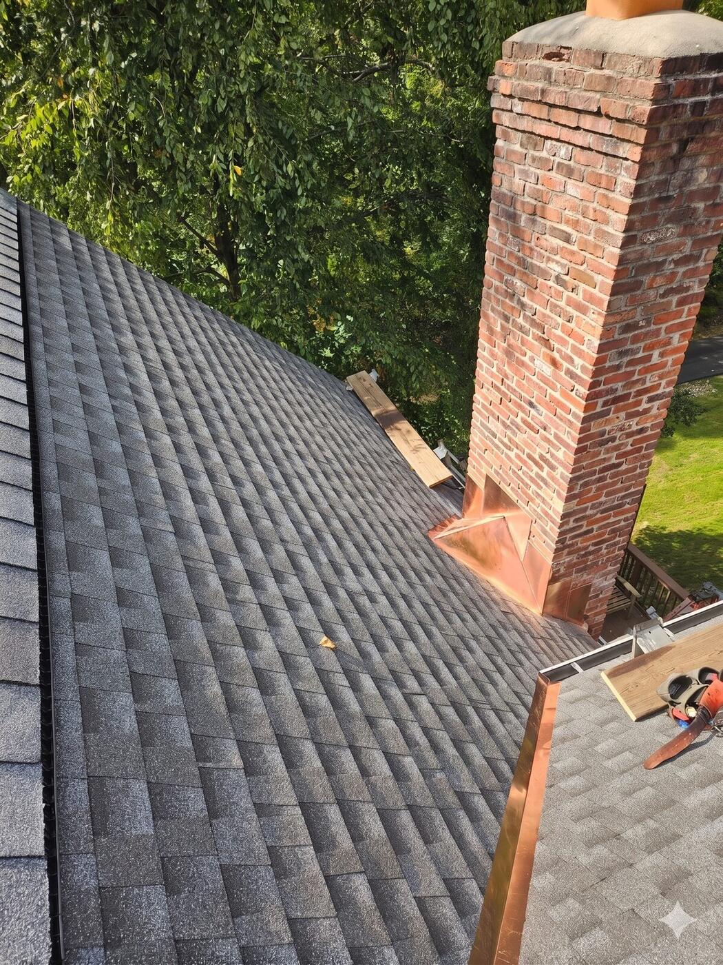 Brick chimney with copper flashing